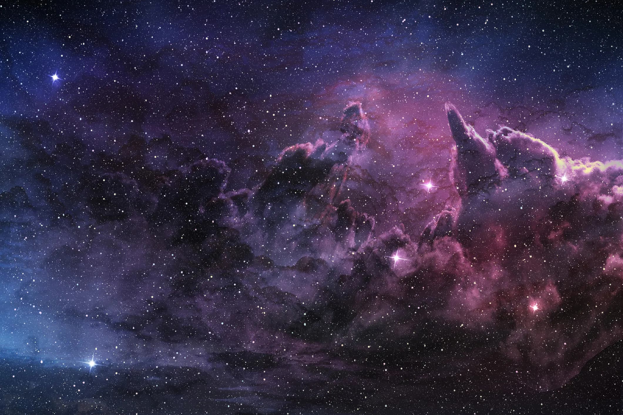 A purple star-forming nebula with pillars of gas and dust